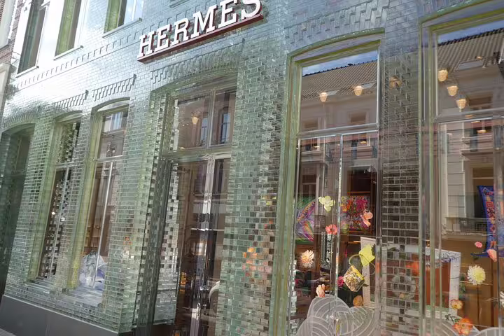 Hermès boutique with shimmering glass-tile facade in Amsterdam, featured on self-guided GPS audio architecture walk