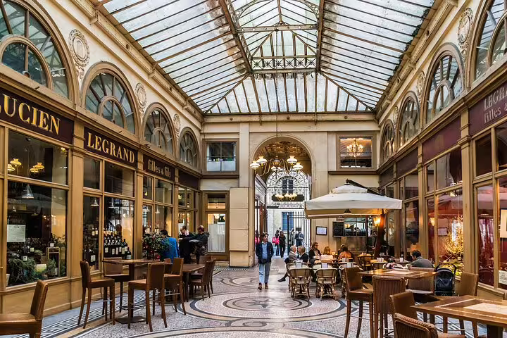 Explore Paris's hidden gems with a charming passage featuring elegant boutiques and inviting cafés, perfect for a unique cultural experience.