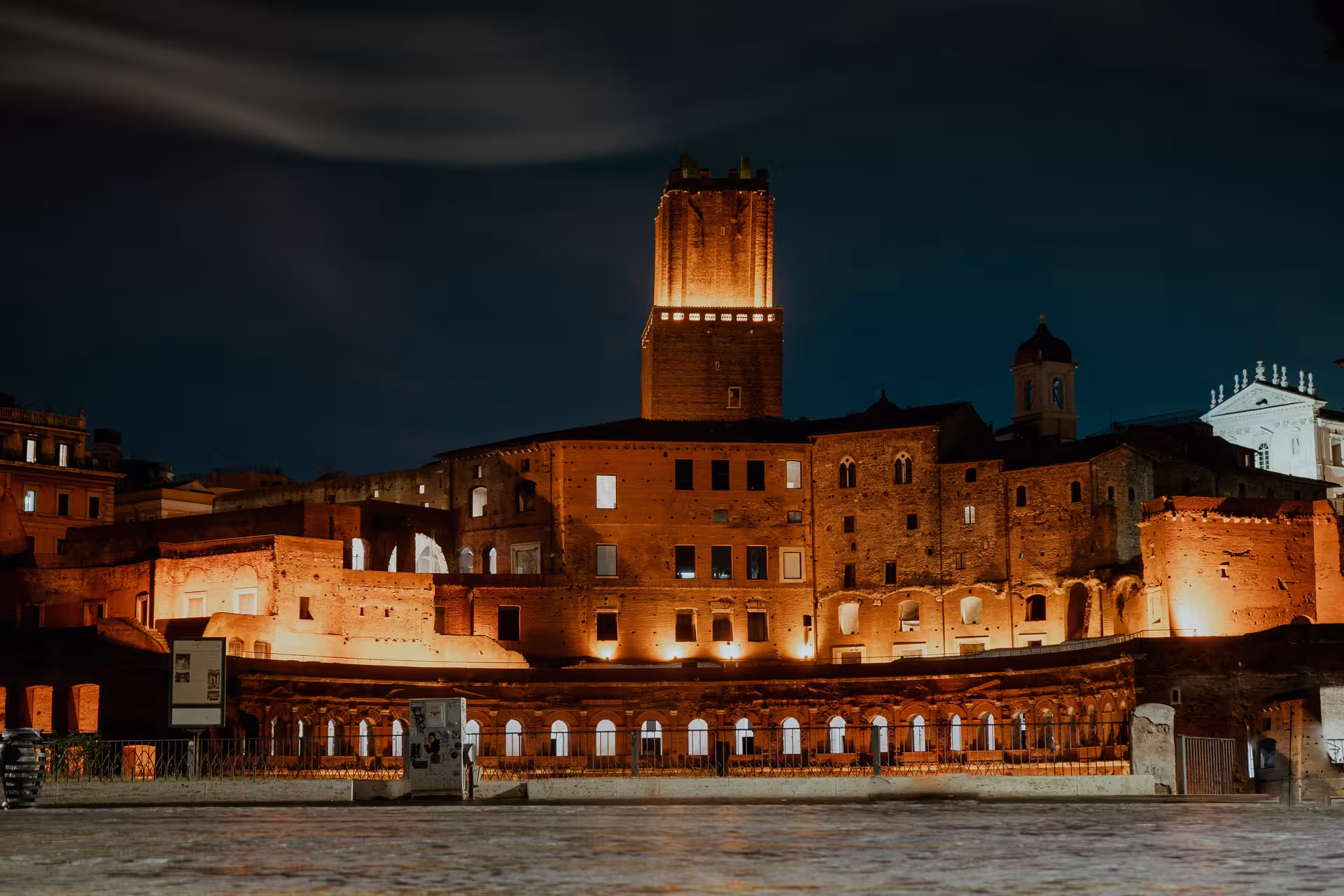Historic Roman site lit up at night, featured in Hidden Rome by Night golf cart tour.