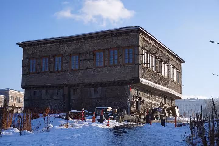 Historic stone building in snowy Erzurum, Turkey, visited on an all-inclusive private guided Erzurum city tour