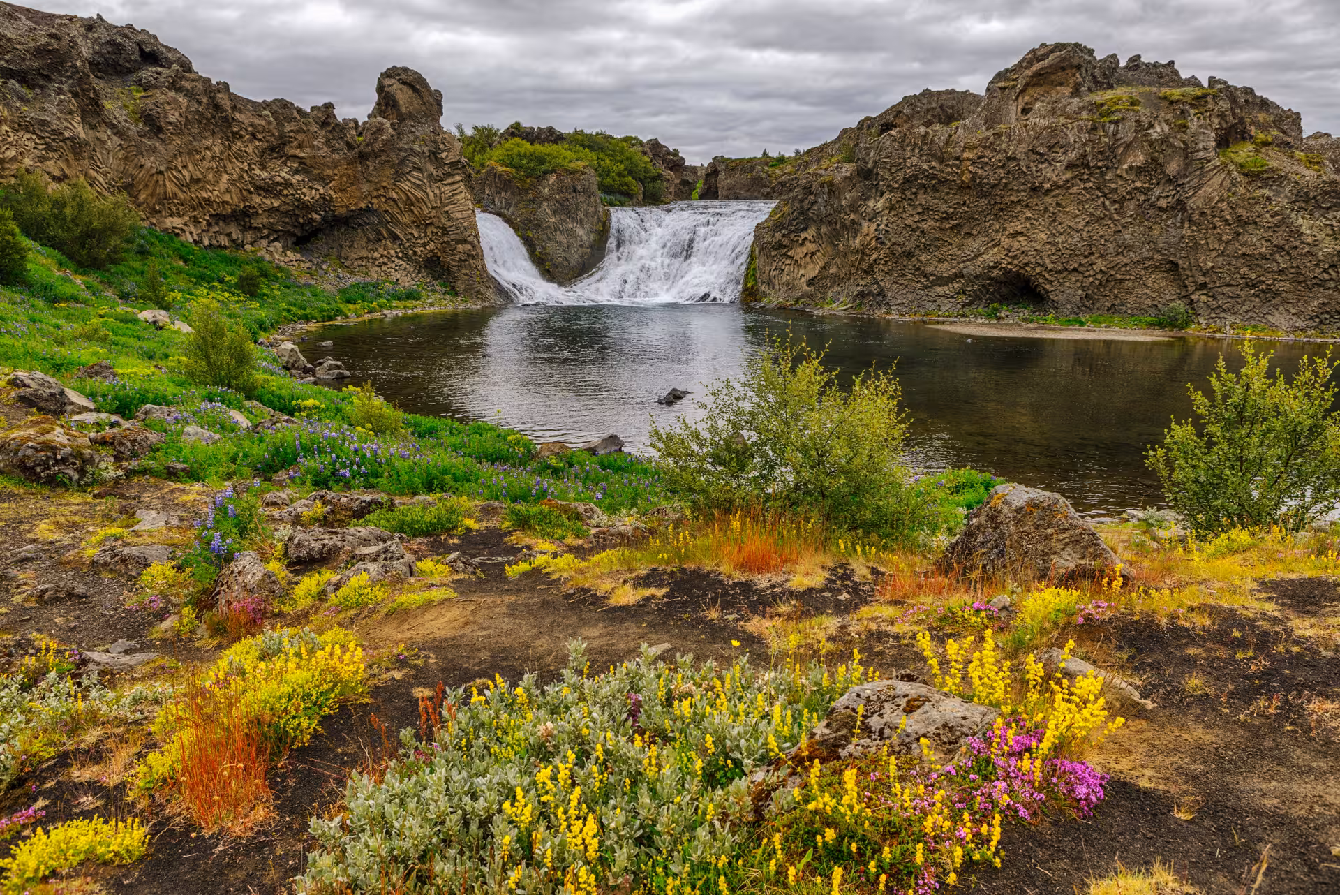 Hjálparfoss waterfall and calm pool in Þjórsárdalur Valley, Iceland, on a private sightseeing tour