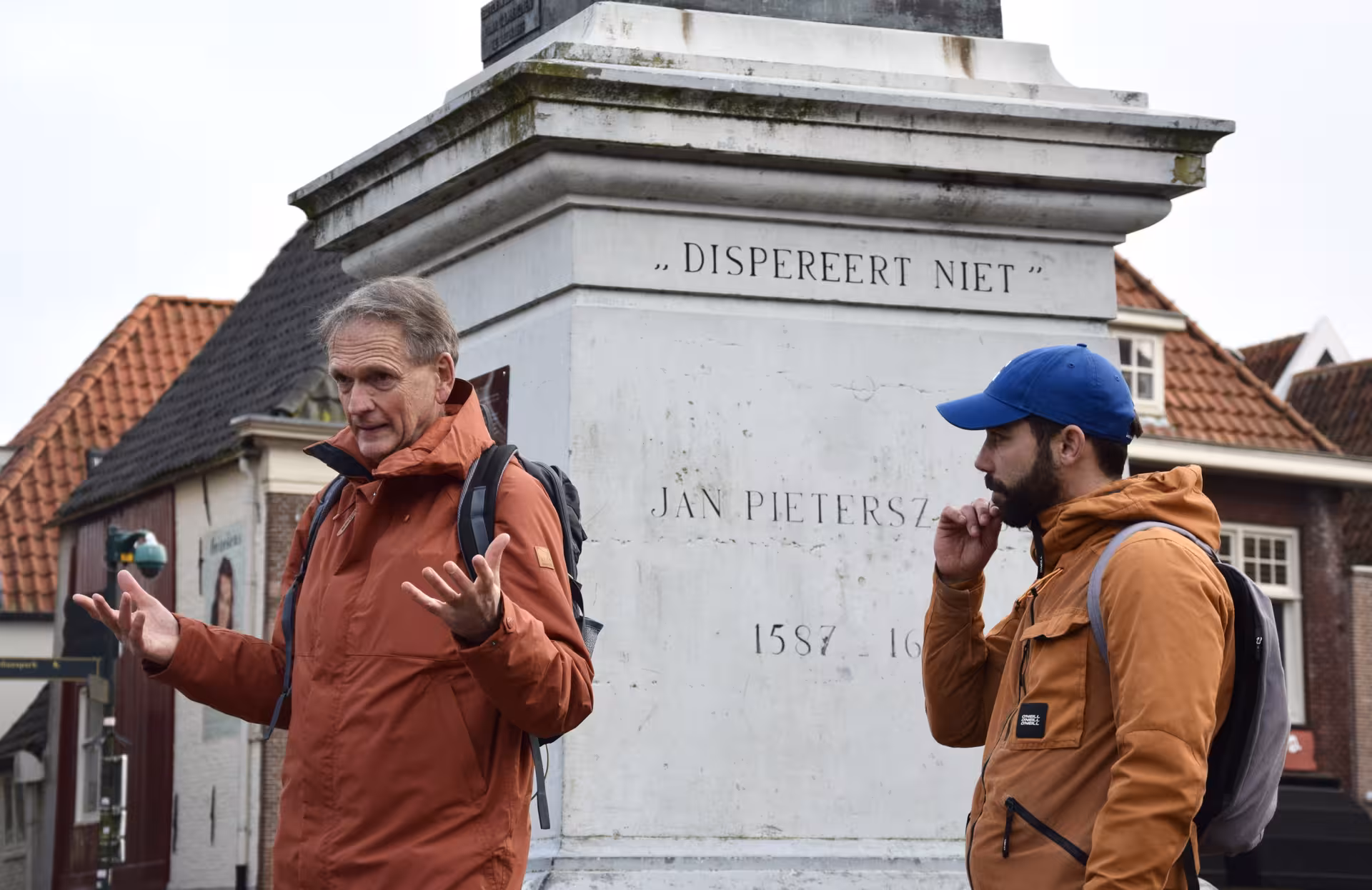 Guide explaining Hoorn history by Jan Pietersz monument during a private 2-hour highlights walking tour