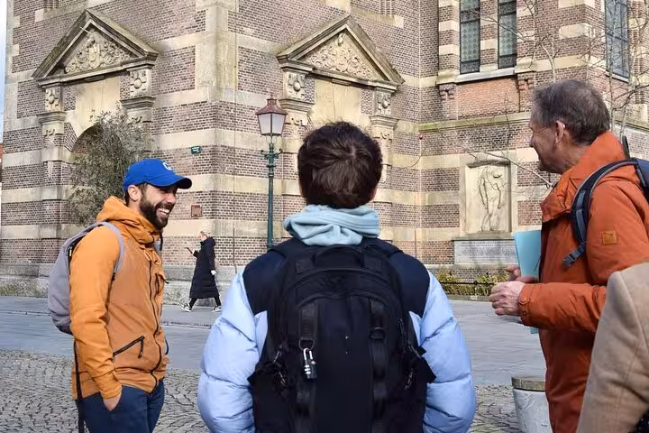 Local guide leads a small group beside Hoorn’s historic church on a 2-hour walking tour of highlights