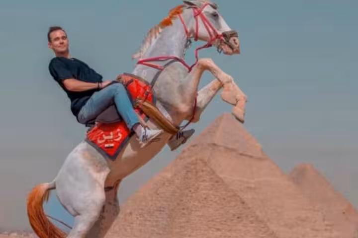 Horse jump photo at Giza Pyramids, rider on rearing horse during half-day pyramids tour with 9-pyramids view