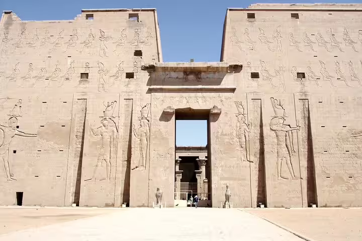 Front view of Horus Temple at Edfu with towering pylons, part of Luxor to Edfu and Kom Ombo temples excursion