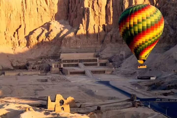 Hot air balloon over Hatshepsut Temple and West Bank cliffs, Luxor sunrise flight with transfer included