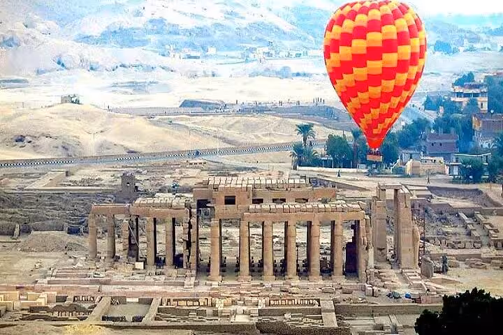 Hot air balloon over Luxor Temple ruins on Sharm El Sheikh to Luxor by plane sharing group day tour