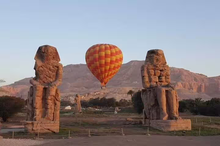 Sunrise hot air balloon over Luxor West Bank with Colossi of Memnon, includes hotel transfer tour