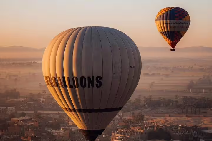 Sunrise hot air balloon flight over Luxor and the Nile Valley, with round-trip transfer included from hotels
