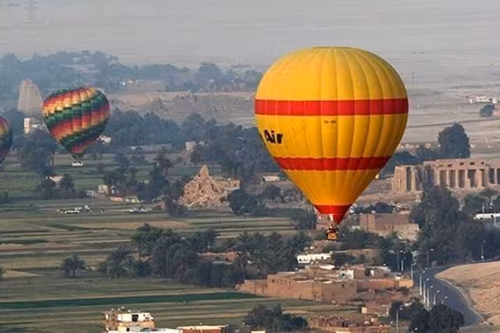 Hot air balloons over Luxor West Bank seen on Sharm El Sheikh to Luxor by plane tour with sharing group