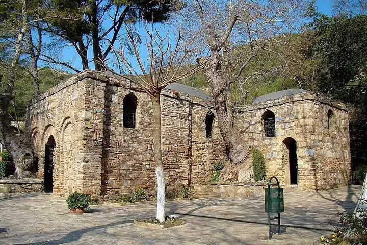 The serene House of the Virgin Mary set in a tranquil landscape, part of the Ephesus Small Group Tour from Izmir.
