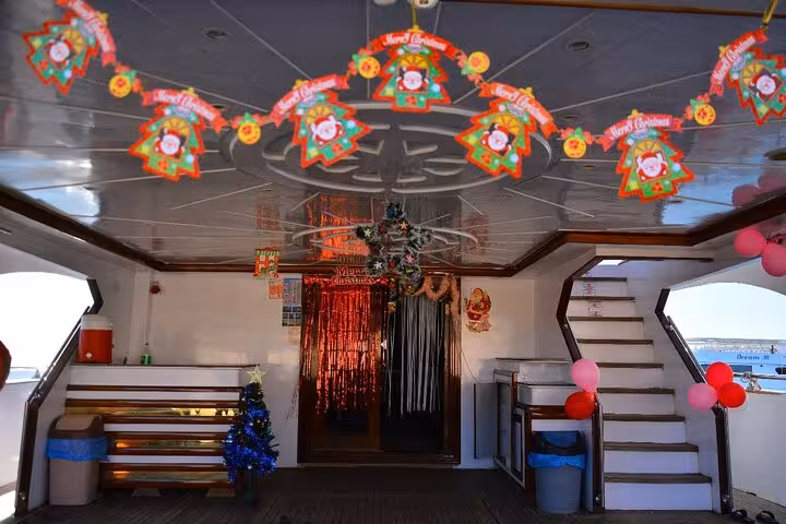Festive yacht deck lounge on Hurghada sailing trip to Hula Hula Island, decorated for Red Sea cruise