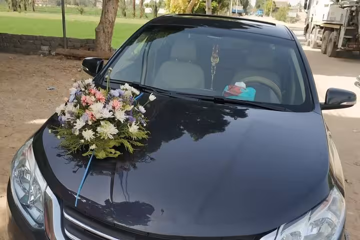 Private sedan transfer for Hurghada Airport to Marsa Alam, clean car with welcome flowers and AC