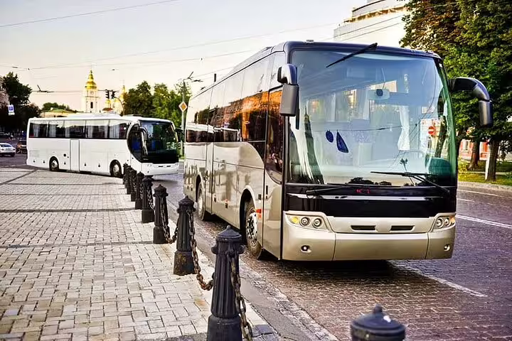 Modern coach and shuttle lineup for Hurghada Airport private transfer service, reliable group transport