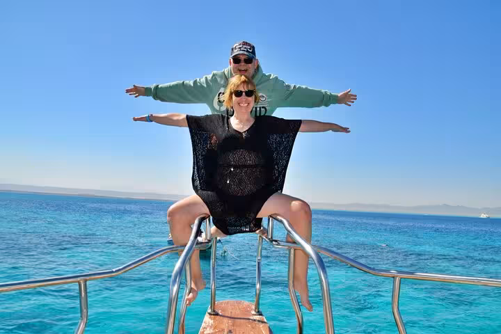 Guests posing on a Hurghada boat deck during Orange Bay & Giftun Island snorkel trip with lunch