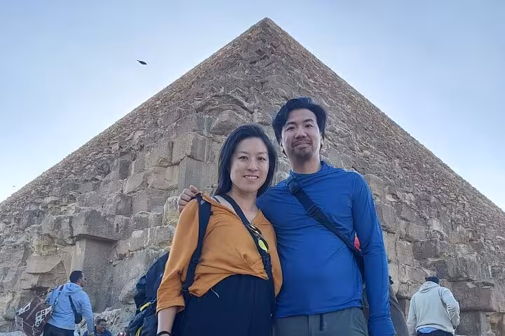 Couple photo at the Great Pyramid of Giza on Hurghada to Cairo private tour, pyramids and Grand Egyptian Museum