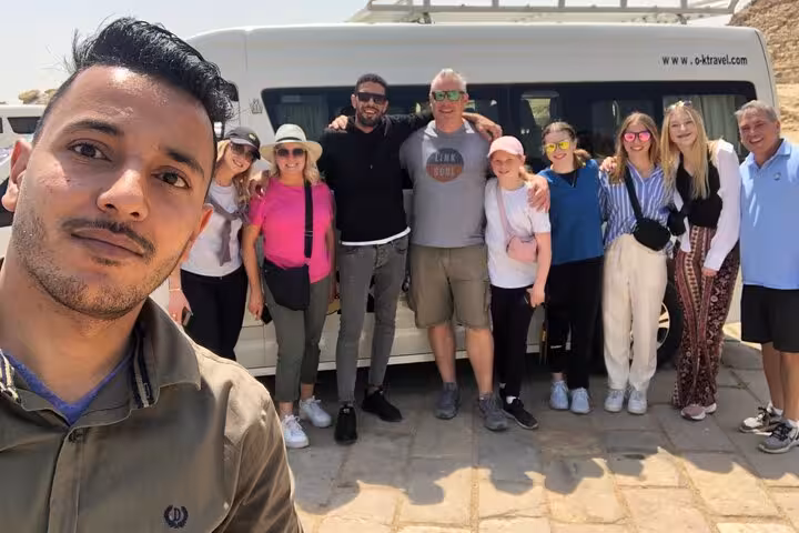 Group photo by tour minibus on Hurghada to Cairo private day trip to Giza Pyramids, GEM and camel ride