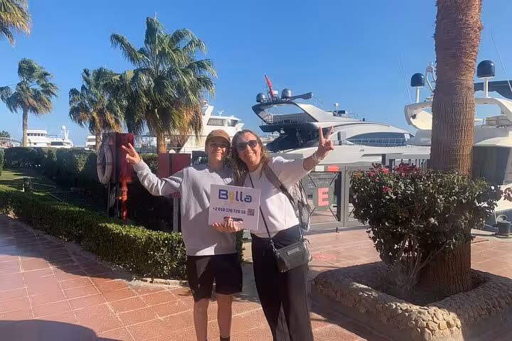 Guests at Hurghada Marina with luxury yachts on a private Hurghada city tour with shopping stop