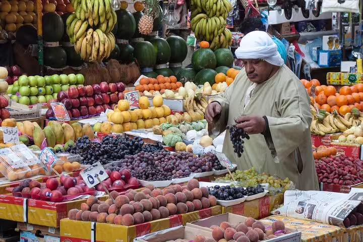 Fruit vendor at Hurghada local market, colorful produce stalls on a customized city tour shopping stop