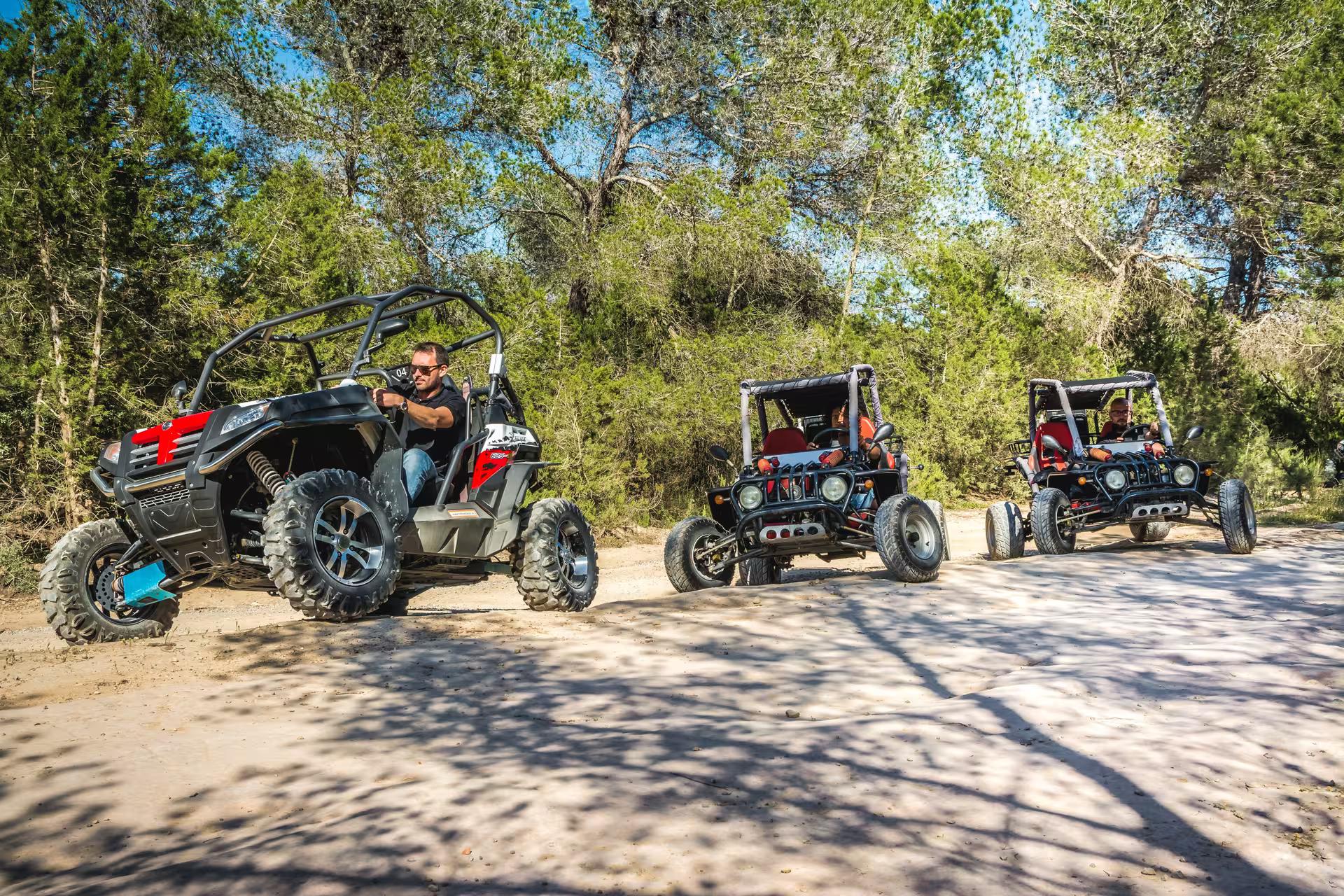 Ibiza buggy day trip convoy on a dusty forest track, exploring southern Ibiza nature near Salinas