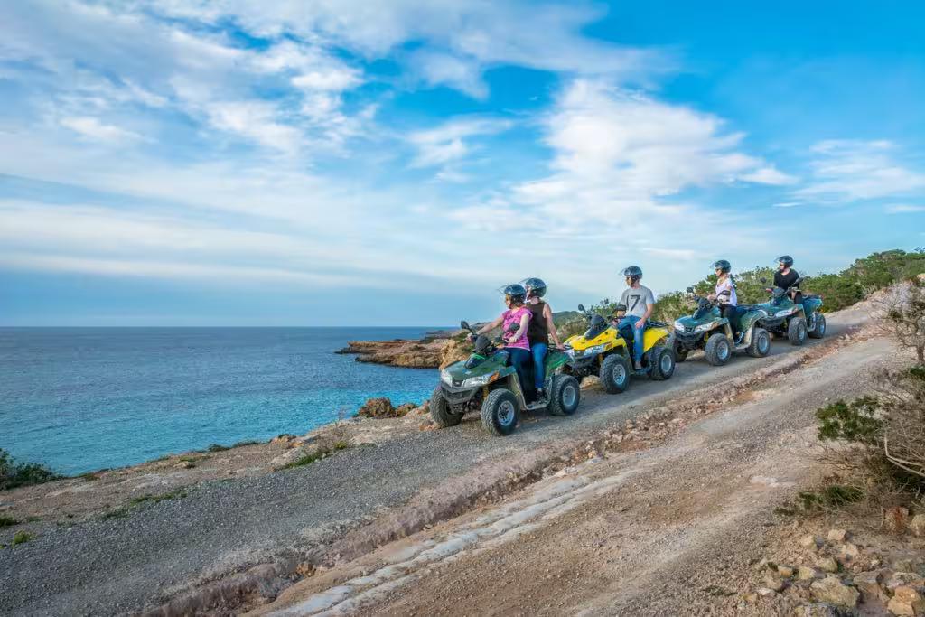 Guided Ibiza off-road buggy tour by the sea, riders on coastal trail exploring southern Ibiza and Salinas