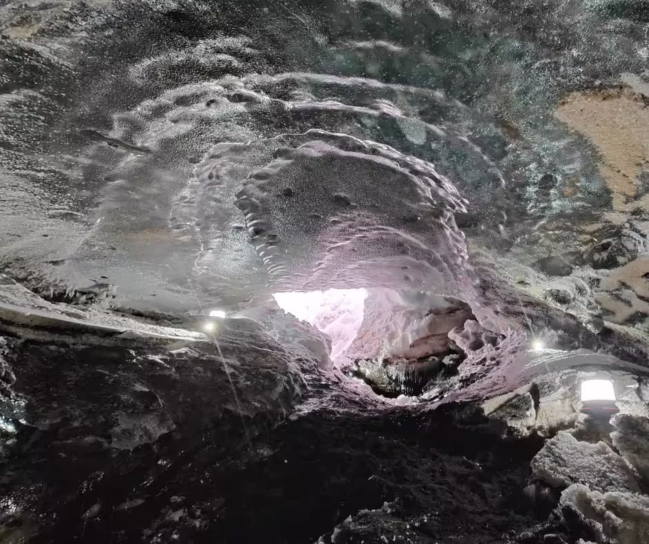 clear and blue ice showing when looking to the entrance of the natural ice cave