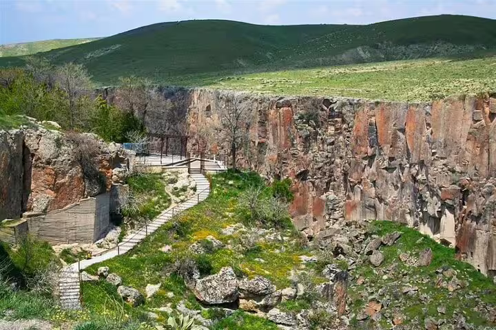 Discover the stunning Ihlara Valley, featuring scenic cliffs and lush greenery on a guided Cappadocia tour.