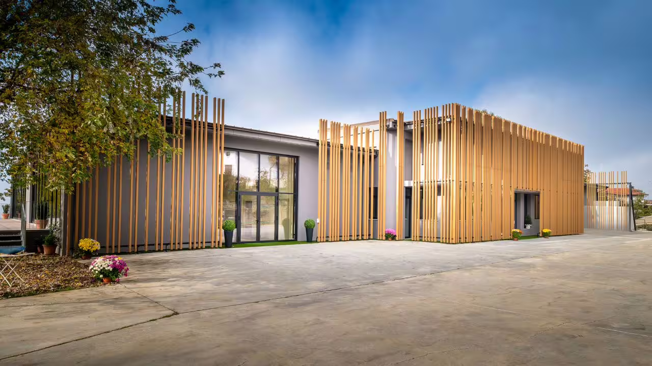 Modern winery building with unique wooden architecture, a highlight of the Nebbiolo, Barbaresco, and Barolo wine tour.