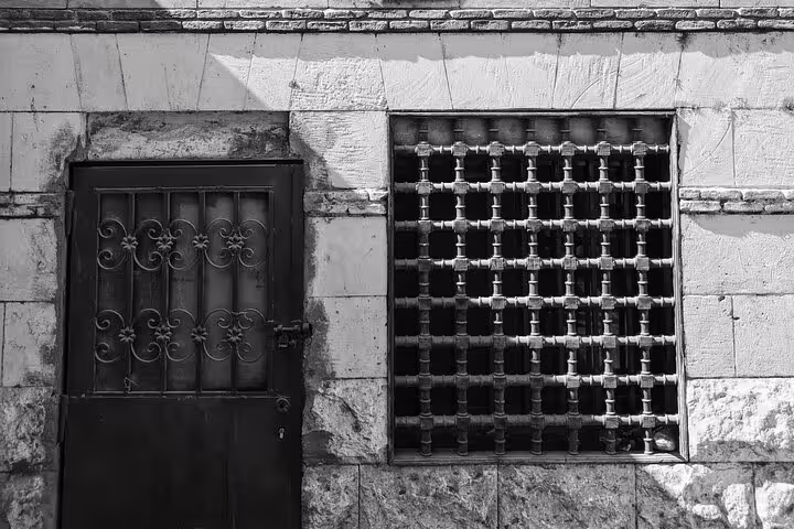 Ornate iron door and lattice window in Islamic Cairo on Al-Mu'izz Street walking tour with dinner