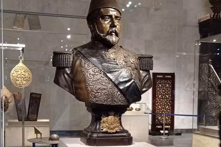 Islamic Cairo museum exhibit with ornate Ottoman-era bust, a highlight on the Citadel and Khan El Khalili tour