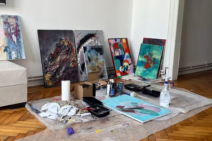 Art supplies and finished canvases set up for Istanbul Art Escape wine and paint at a local’s home studio