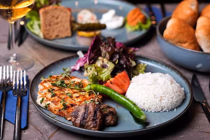 Grilled chicken and Turkish meze dinner served on Istanbul Bosphorus dinner cruise with private table