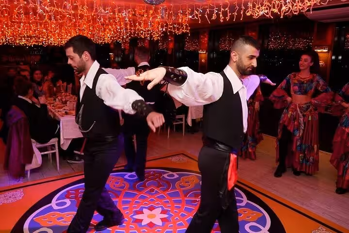 Turkish folk dancers perform onboard Istanbul Bosphorus dinner cruise Turkish night with private table
