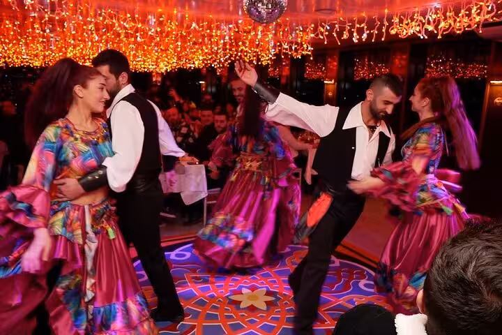 Turkish folk dancers performing on Istanbul Bosphorus dinner cruise Turkish night with private table