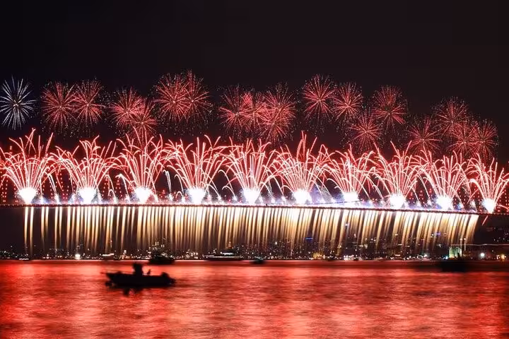 Red New Year fireworks over Istanbul Bosphorus, perfect view from a New Year’s Eve dinner cruise party