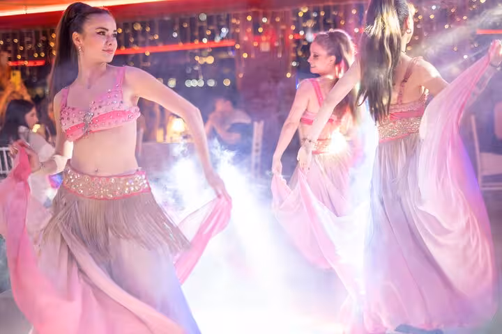 Belly dancers performing live show on Istanbul Bosphorus New Year’s Eve dinner cruise party