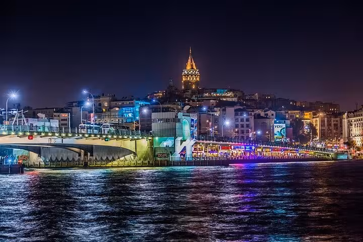 Galata Tower and Golden Horn night skyline seen from an Istanbul Bosphorus New Year’s Eve dinner cruise