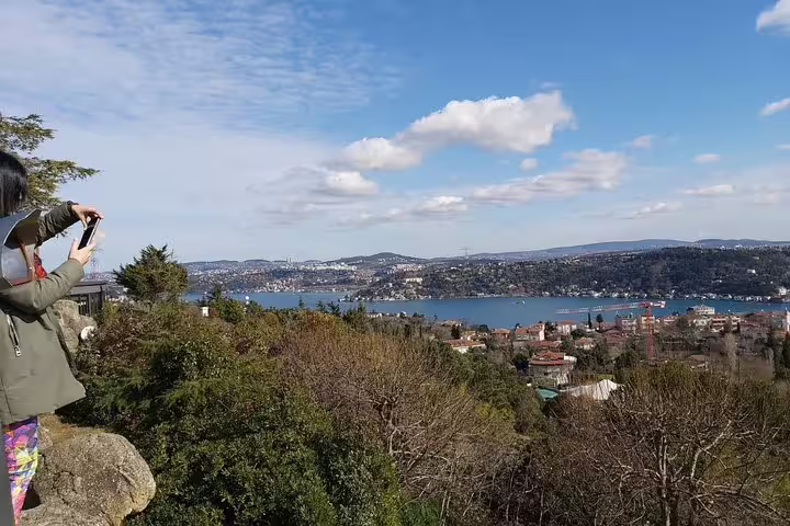 Traveler photographing panoramic Bosphorus Strait viewpoint, ideal stop on a private flexible Istanbul tour