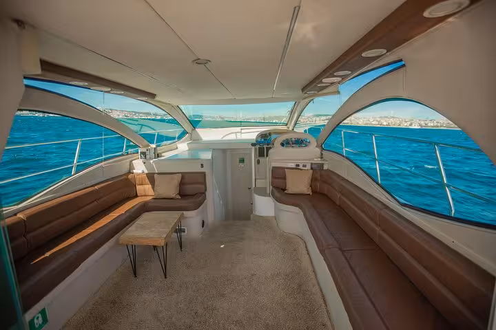 Spacious covered deck seating on private Bosphorus yacht cruise in Istanbul with panoramic sea views
