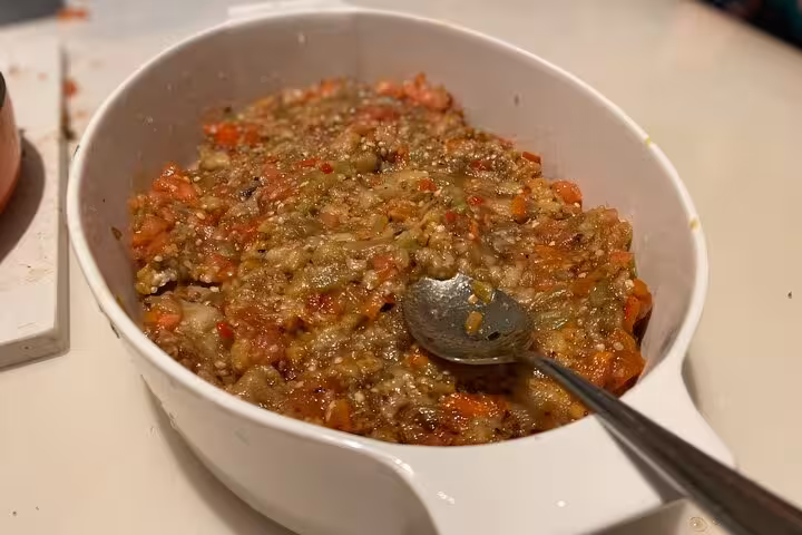 Close-up of smoky eggplant and tomato mezze prepared in an Istanbul vegan vegetarian cooking class at home