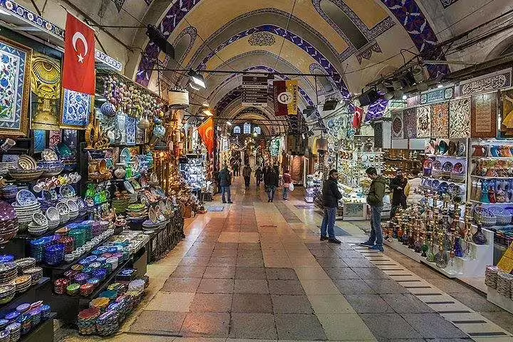 Explore the vibrant Grand Bazaar in Istanbul, featuring colorful ceramics and traditional Turkish goods.