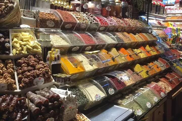 Colorful spice and dried fruit stalls at Istanbul Grand Bazaar on Turkey Delights private 10-day tour