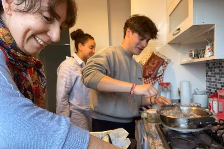Hands-on Istanbul home cooking class, guests stirring Turkish dishes in a neighborhood kitchen local life tour