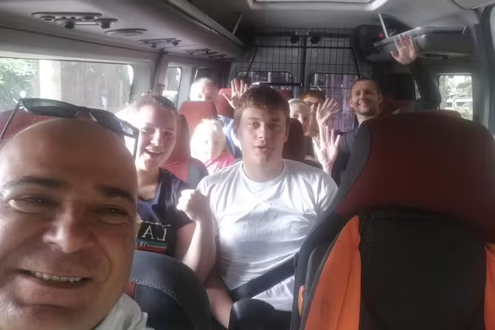 Happy travelers inside a private minibus transfer from Istanbul to Lake Sapanca and Maşukiye day tour