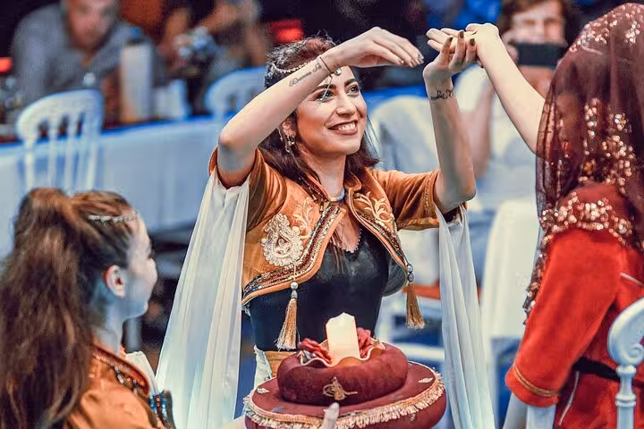 Guests enjoy Turkish folk dance show on Istanbul New Year's Eve Bosphorus dinner cruise party