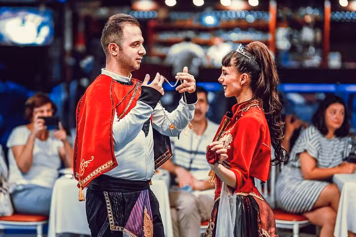 Couple in folk costumes performs live dance on Istanbul New Year’s Eve Bosphorus cruise with dinner and show