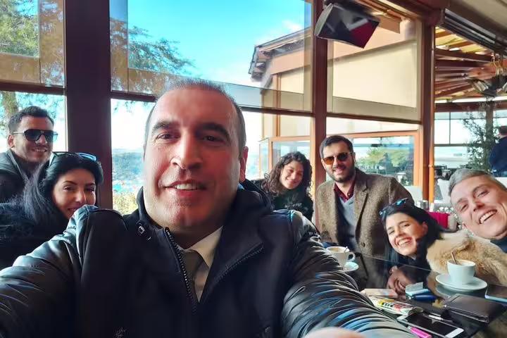 Happy group selfie at a cafe stop on a private and flexible Istanbul sightseeing experience with local guide