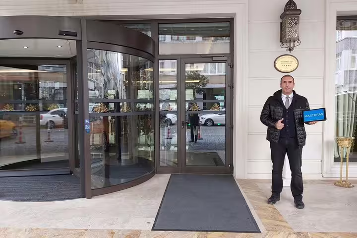 Private Istanbul tour driver guide greeting at hotel pickup entrance for a flexible sightseeing experience