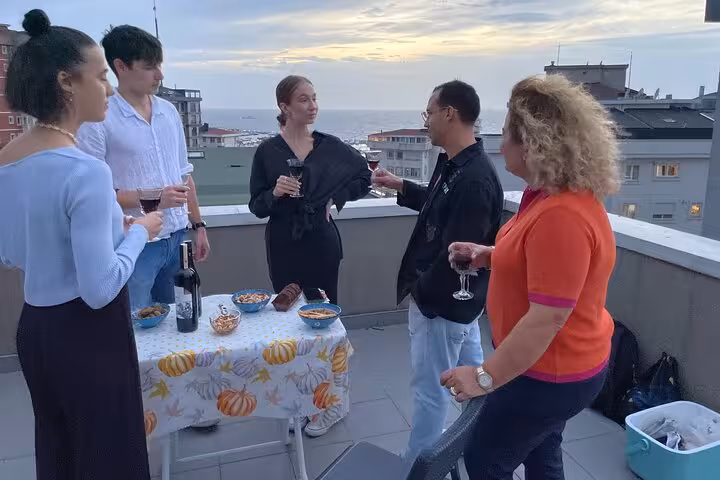 Rooftop Istanbul wine tasting at home with local family, sunset Bosphorus views and mezze pairing