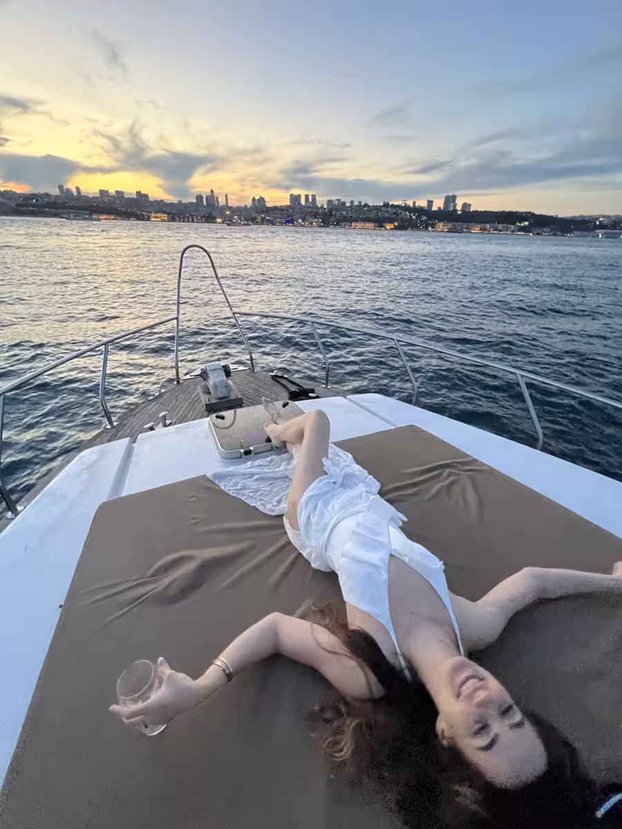 Sunset lounging on a private Istanbul Bosphorus yacht tour, with skyline views and relaxing swim break vibes